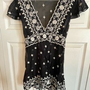 Sheer cap sleeve top.